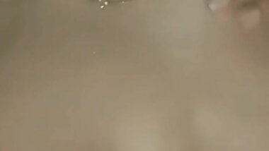 Teen girlfriend spits and plays with her beautiful breasts.