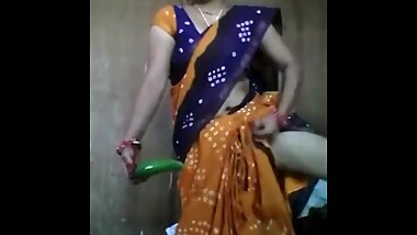 Bhabi put cucumber in her pussy
