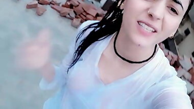 Pakistani girl in rain bathing