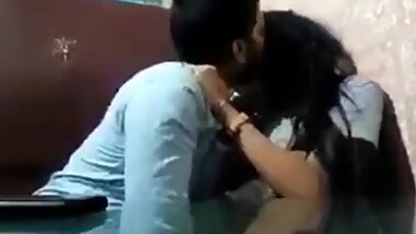 Desi couple kissing in a cafe